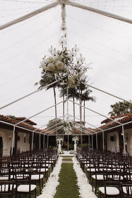 Casa Romantica outdoor wedding ceremony in couryard with chic, clear tent