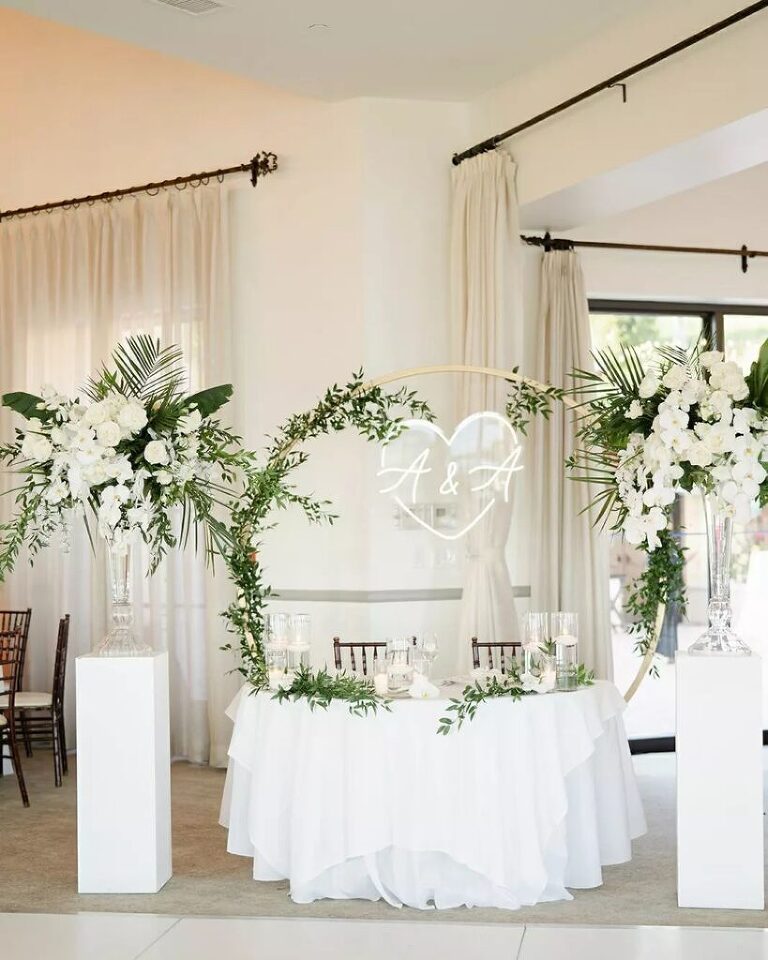 Tropical infused floral designs with timeless white blooms at Bel Air Bay Club.