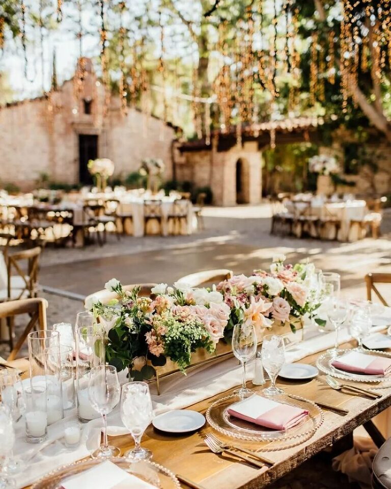 Soft floral designs for an outdoor wedding reception at Hummingbird Nest Ranch,